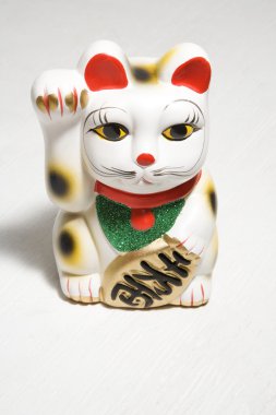 Japanese cat figurine. clipart