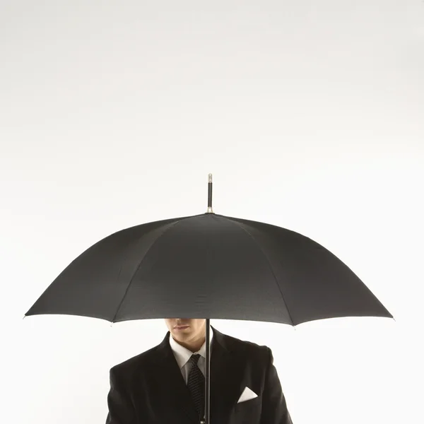 Affärsman med paraply. — Stockfoto
