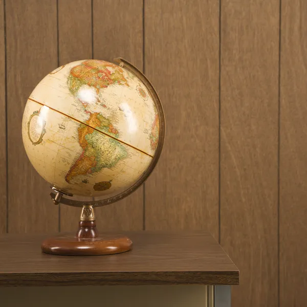 Globe on desk. — Stock Photo, Image