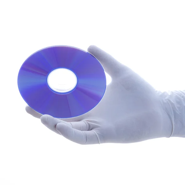 Gloved hand holding disc. — Stock Photo, Image