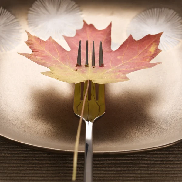 Fall leaf on fork. — Stock Photo, Image