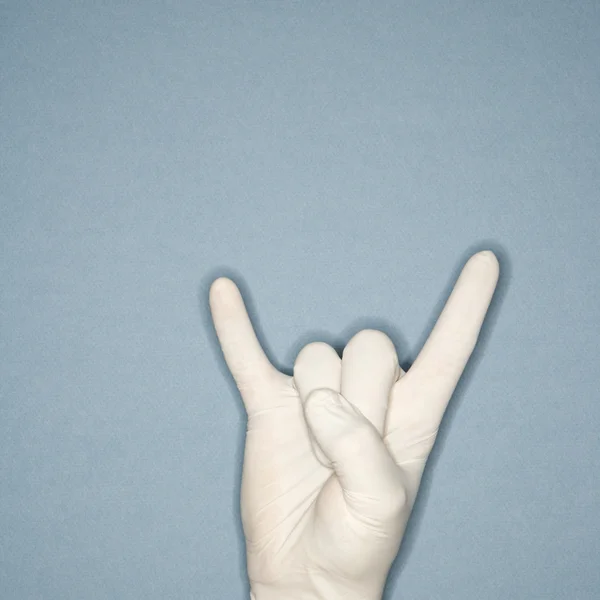 Rubber gloved hand gesture. — Stock Photo, Image