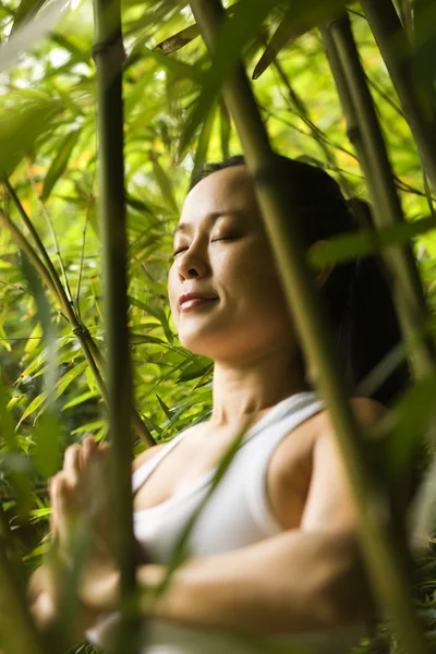 stock image Asian woman meditating.