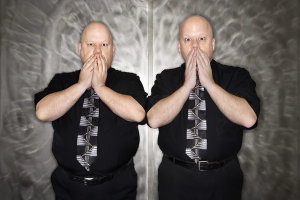 Twin men covering mouth. — Stock Photo, Image