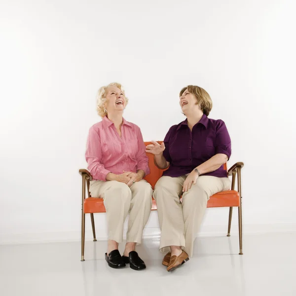 Women sitting laughing. — Stock Photo, Image