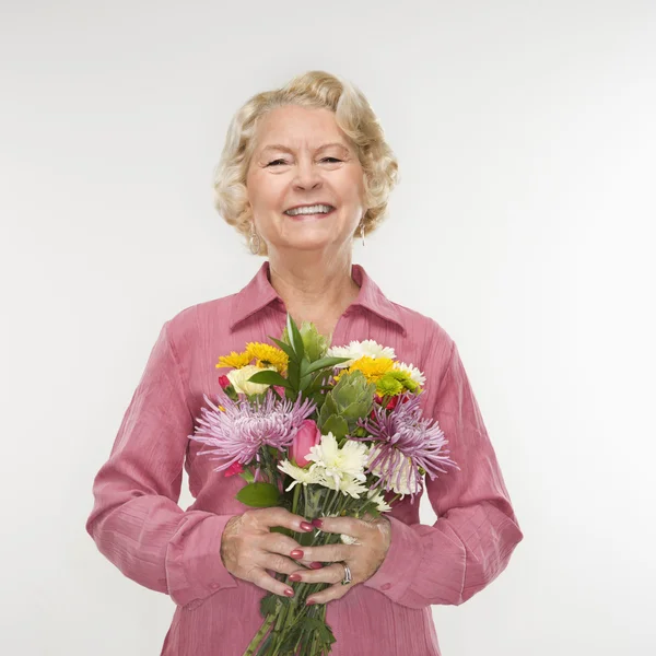 Woman holding bouquet. — Stock Photo, Image