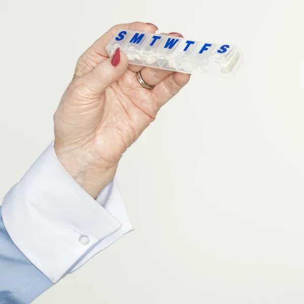 Hand holding pill box. — Stock Photo, Image