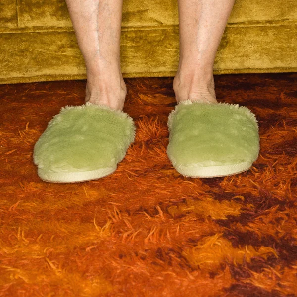 Feet wearing slippers. — Stock Photo, Image