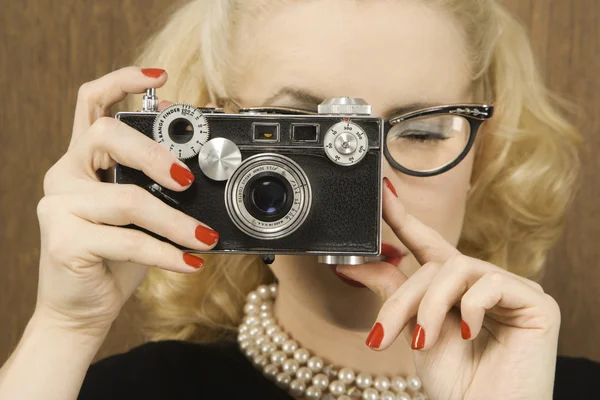 Woman taking photograph. Royalty Free Stock Images