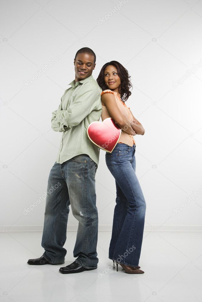 Couple holding valentine heart.