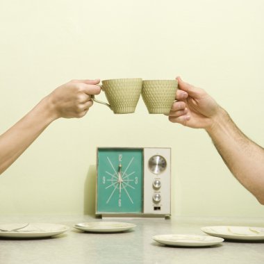 Hands toasting cups. clipart