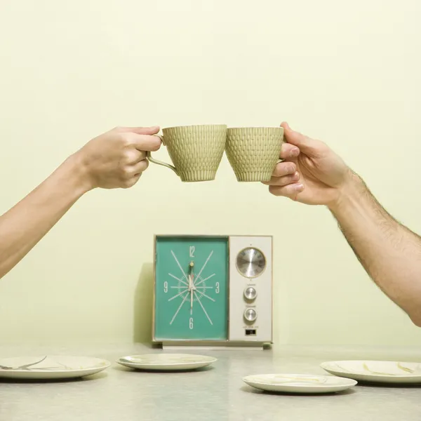 Hands toasting cups. — Stock Photo, Image