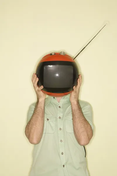 TV över mannens huvud. — Φωτογραφία Αρχείου