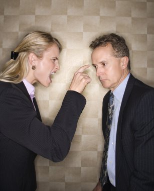 Businesswoman Reprimanding Businessman clipart