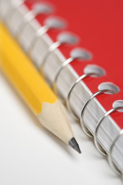 Pencil and notebook. clipart