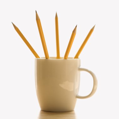 Pencils in coffee cup. clipart