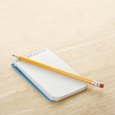 Pencil on notepad. clipart