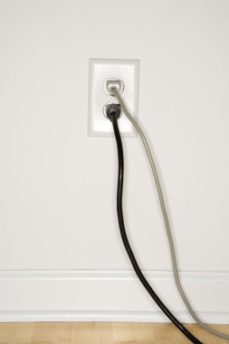 Wall outlet with plugs. clipart