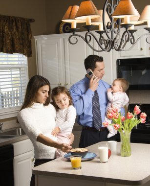 Family in kitchen. clipart