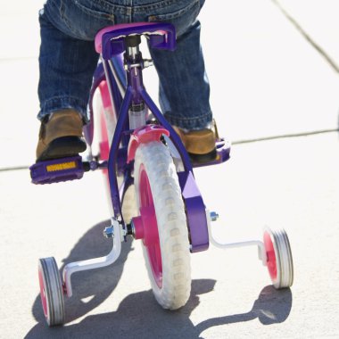 Girl riding bike. clipart