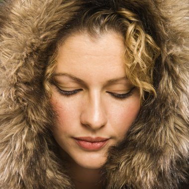 Woman with fur hood. clipart