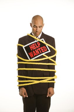 Businessman tied in rope. clipart