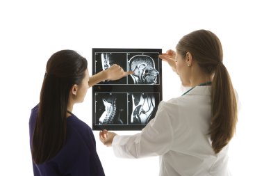 Doctors analyzing x-ray. clipart