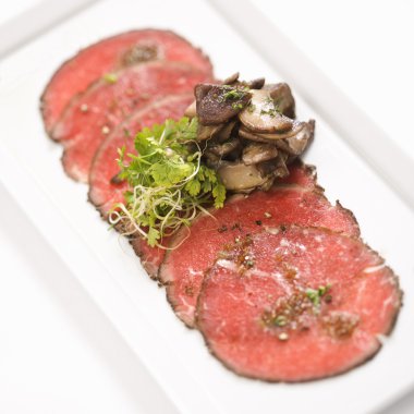 Beef carpaccio with mushrooms. clipart