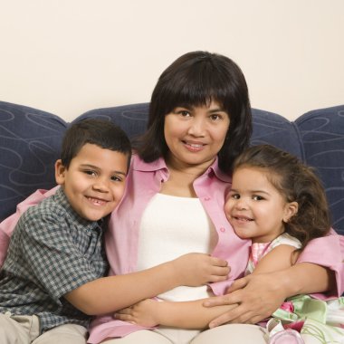 Family hugging together. clipart