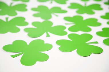 Green paper shamrocks. clipart