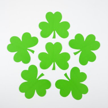 Green paper shamrocks. clipart