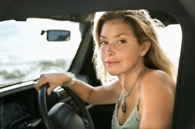 Blonde Woman Sitting in Car clipart