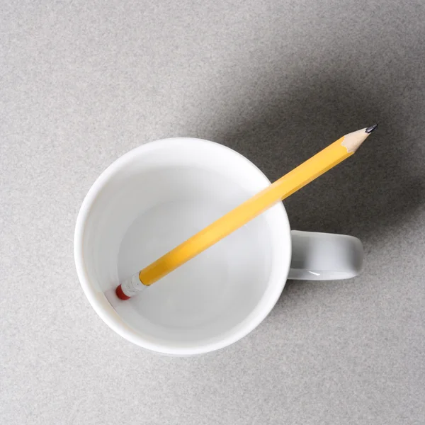 Pencil in coffee cup. — Stock Photo, Image