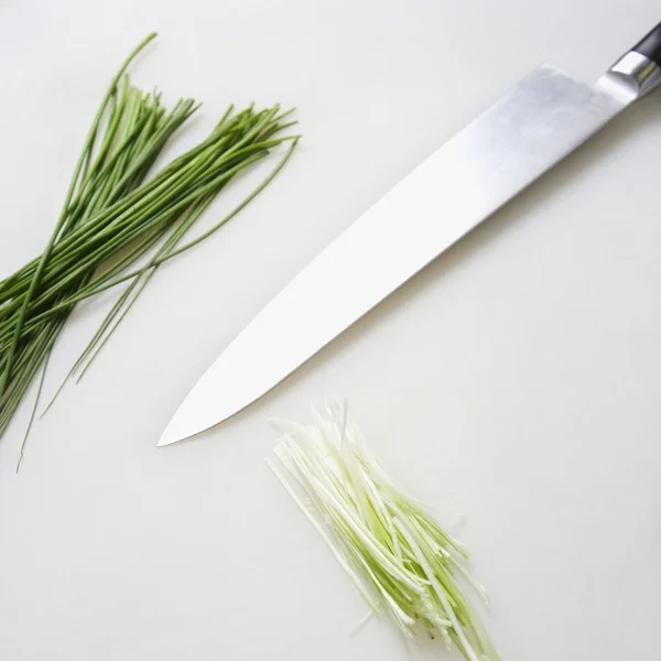 Chives with knife. — Stock Photo, Image