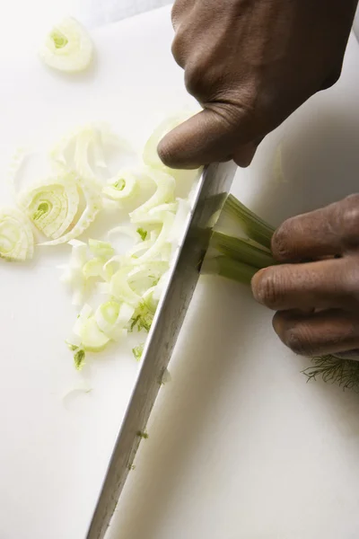 Knife chopping fennel. — Stock Photo, Image