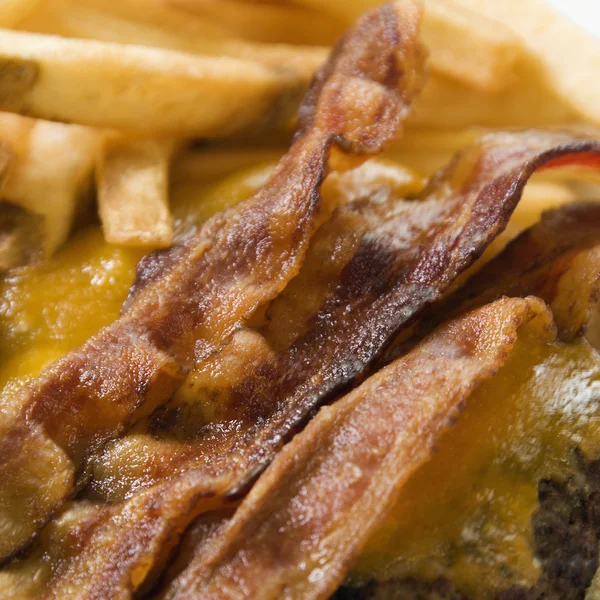 Bacon cheeseburger and fries. — Stock Photo, Image