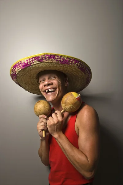Man with sombrero and maracas. — Stock Photo, Image