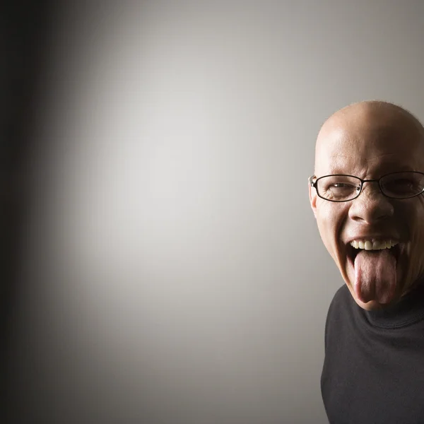 Man sticking out tongue. — Stock Photo, Image