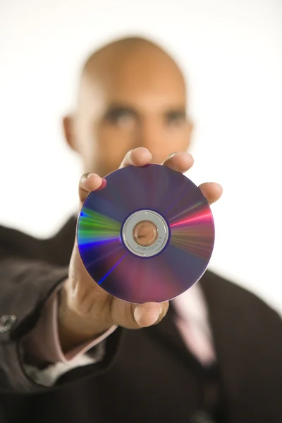 Людина тримає компакт-диск . — стокове фото