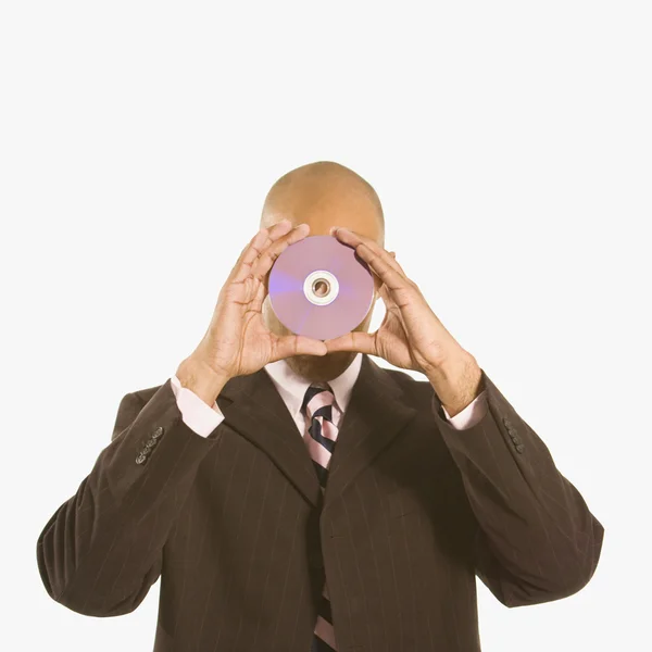 Homme tenant un disque compact . — Photo