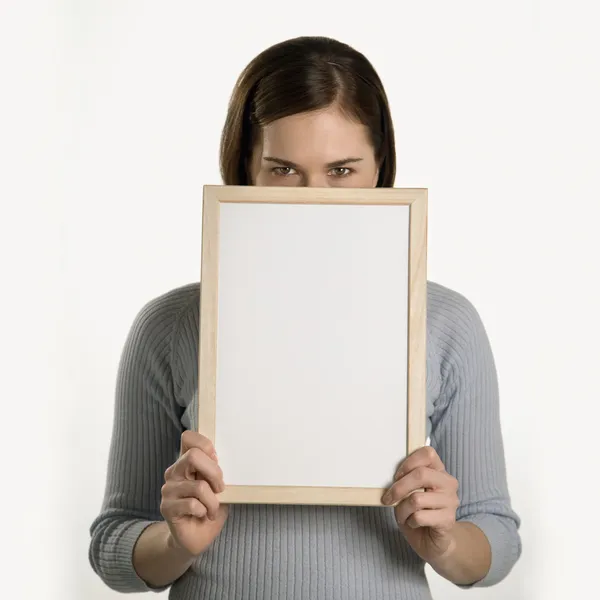 Woman holding blank sign. — Stock Photo, Image