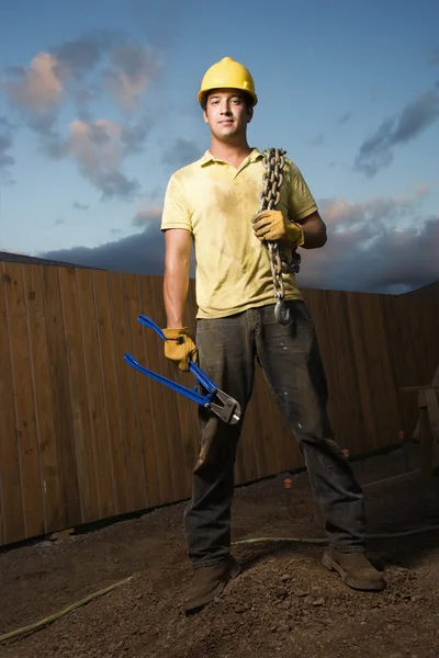 Construction Worker with Bolt Cutters and Chain — Stock Photo, Image