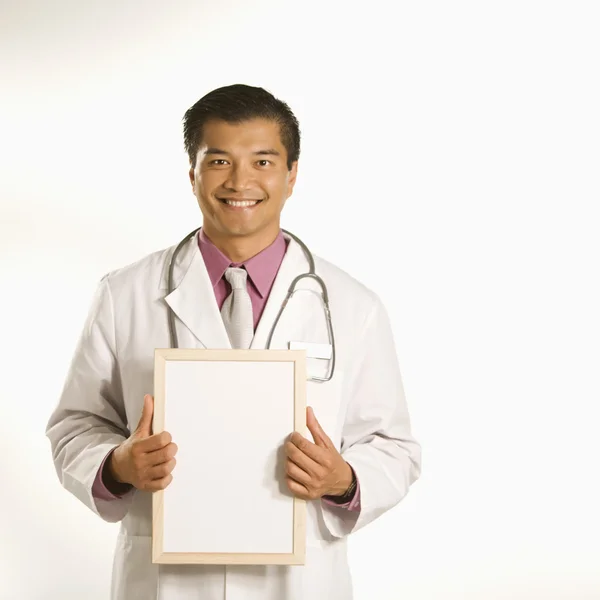 Doctor holding blank sign. — Stock Photo, Image