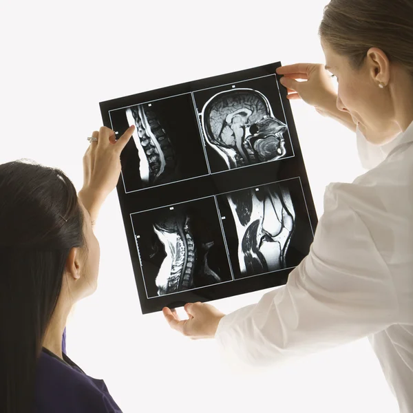 Doctors analyzing x-ray. — Stock Photo, Image