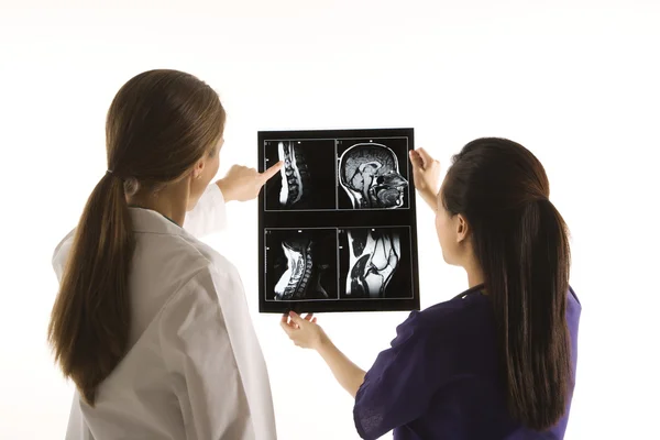 Doctors analyzing x-ray. — Stock Photo, Image