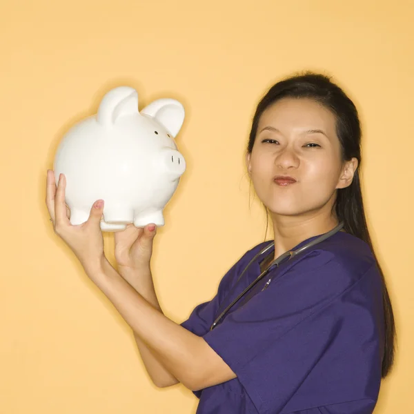Woman and piggy bank. — Stock Photo, Image