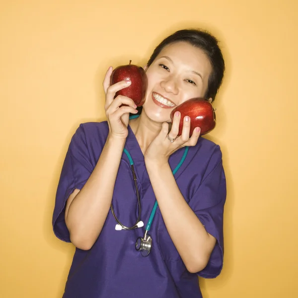 Doctor and apples. — Stock Photo, Image
