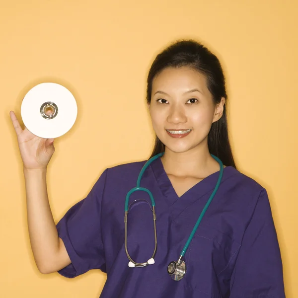 Doctor and CD. — Stock Photo, Image