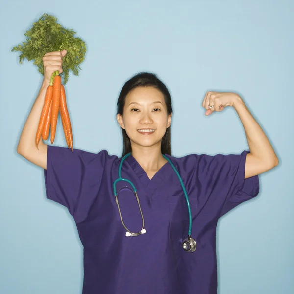 Doctor and carrots. — Stock Photo, Image