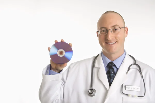 Doctor holding compact disc. — Stock Photo, Image